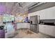 Well-lit kitchen featuring white cabinets, stainless steel appliances, and an open layout, ideal for cooking at 5096 Thunder River Cir, Las Vegas, NV 89148