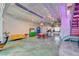 Bright, open living space with exposed ceiling, polished concrete floors, and a modern, colorful aesthetic at 5096 Thunder River Cir, Las Vegas, NV 89148