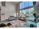 Bright living room with soaring ceilings, large windows and an open floor plan; great for entertaining at 5096 Thunder River Cir, Las Vegas, NV 89148