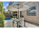 Inviting patio with dining set, landscaping, and refreshing plunge pool at 5096 Thunder River Cir, Las Vegas, NV 89148