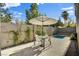 Inviting patio with dining set, landscaping, and refreshing plunge pool at 5096 Thunder River Cir, Las Vegas, NV 89148