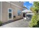 A well-designed patio with a dining set, landscaping, and low-maintenance yard at 5096 Thunder River Cir, Las Vegas, NV 89148