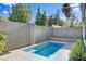 Backyard featuring an inviting rectangular pool with modern landscaping at 5096 Thunder River Cir, Las Vegas, NV 89148