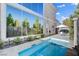 Private pool and spa in backyard, with built-in seating and lush landscaping; perfect for relaxation at 5096 Thunder River Cir, Las Vegas, NV 89148