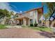A view of the house and the backyard with a built-in grill and a gravel ground cover at 5405 Ireland St, Las Vegas, NV 89149