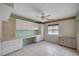 Bedroom with tile floors, abundant cabinets and shelving, and a ceiling fan with decorative lighting at 5405 Ireland St, Las Vegas, NV 89149