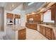 Well lit kitchen featuring an island, tile floors, granite countertops, and stainless steel appliances at 5405 Ireland St, Las Vegas, NV 89149