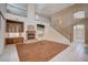 Living room with a fireplace, built-in shelving, staircase, and entry way at 5405 Ireland St, Las Vegas, NV 89149