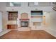 Living room featuring a fireplace, built-in shelving, and a desk area at 5405 Ireland St, Las Vegas, NV 89149