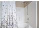 Clean bathroom featuring a shower-tub combination with a stylish floral shower curtain at 5710 E Tropicana Ave # 2122, Las Vegas, NV 89122