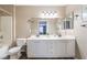 Bathroom with double sink vanity, bright lighting, and tile flooring at 5710 E Tropicana Ave # 2122, Las Vegas, NV 89122