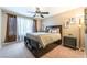 Bedroom with carpet flooring, ceiling fan, and abundant natural light at 5710 E Tropicana Ave # 2122, Las Vegas, NV 89122