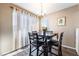 Cozy dining area featuring a wooden table, chairs, and plenty of natural light at 5710 E Tropicana Ave # 2122, Las Vegas, NV 89122