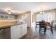 Bright kitchen area with stainless appliances adjacent to dining and living area at 5710 E Tropicana Ave # 2122, Las Vegas, NV 89122