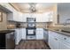 Well-equipped kitchen features stainless steel appliances and sleek design with ample storage at 5710 E Tropicana Ave # 2122, Las Vegas, NV 89122