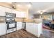 Modern kitchen boasts stainless steel appliances, ample counter space, and white cabinetry at 5710 E Tropicana Ave # 2122, Las Vegas, NV 89122