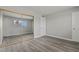 Spacious bedroom featuring a large mirrored closet and gray plank flooring at 6437 Burgundy Way, Las Vegas, NV 89107