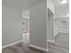 Open hallway with gray plank flooring leads to the backyard through bright glass panel doors at 6437 Burgundy Way, Las Vegas, NV 89107