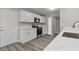 Bright kitchen featuring stainless appliances, sleek white cabinets, grey walls, and white countertops at 6437 Burgundy Way, Las Vegas, NV 89107