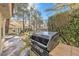 An outdoor grill with view of backyard landscaping and greenery at 6961 Emerald Springs Ln, Las Vegas, NV 89113