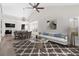 Staged living room and dining area featuring modern furniture and decor at 6961 Emerald Springs Ln, Las Vegas, NV 89113