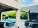 Relaxing outdoor space with a pool, spa, covered patio, and outdoor kitchen area with seating at 7109 Rancho De Taos, Las Vegas, NV 89130