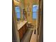 Well-lit bathroom featuring a double sink vanity with framed mirror, striped rugs and decor at 7109 Rancho De Taos, Las Vegas, NV 89130