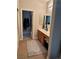 Bathroom with a vanity, a sink, and a walk-in closet with additional storage at 7109 Rancho De Taos, Las Vegas, NV 89130