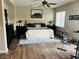Spacious bedroom featuring a king bed, ceiling fan, and a large window providing ample natural light at 7109 Rancho De Taos, Las Vegas, NV 89130