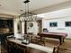 Bright dining room featuring stylish chandelier, pool table, and ample space for entertaining at 7109 Rancho De Taos, Las Vegas, NV 89130