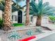 Stunning curb appeal featuring palm trees, decorative rock, and a two-car garage at 7109 Rancho De Taos, Las Vegas, NV 89130