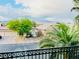 Neighborhood view with palm trees, tile roofs, and mountain scenery in the distance at 7109 Rancho De Taos, Las Vegas, NV 89130