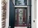 Elegant front door with decorative glass, side windows, and welcoming wreath at 7109 Rancho De Taos, Las Vegas, NV 89130