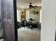Comfortable home office space with a ceiling fan, desk, and decorative wall hangings at 7109 Rancho De Taos, Las Vegas, NV 89130