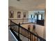 Spacious interior with dark railings, detailed trim work, and an open floor plan at 7109 Rancho De Taos, Las Vegas, NV 89130