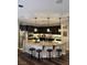 Kitchen features a large center island with granite countertops and stylish pendant lighting at 7109 Rancho De Taos, Las Vegas, NV 89130