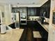 Beautiful kitchen featuring dark cabinetry, granite counters, and stainless steel appliances at 7109 Rancho De Taos, Las Vegas, NV 89130