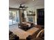 Inviting living room with a ceiling fan, fireplace, and sliding glass doors to an outdoor patio at 7109 Rancho De Taos, Las Vegas, NV 89130