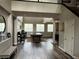 Spacious living room with hardwood floors, bright windows, and modern furnishings at 7109 Rancho De Taos, Las Vegas, NV 89130