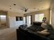 Open concept living room complete with a large sectional sofa and entertainment center at 7109 Rancho De Taos, Las Vegas, NV 89130