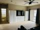 Open living area with built-in cabinets, a ceiling fan, a sliding glass door, and modern furnishings at 7109 Rancho De Taos, Las Vegas, NV 89130