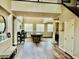 Open-concept living room featuring hard wood flooring, and plenty of natural light at 7109 Rancho De Taos, Las Vegas, NV 89130