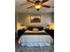 Inviting main bedroom features a tufted headboard, soft lighting, and a neutral color palette at 7109 Rancho De Taos, Las Vegas, NV 89130