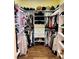 Organized walk-in closet with custom shelving, hanging rods, and storage space for shoes and accessories at 7109 Rancho De Taos, Las Vegas, NV 89130