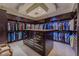 Walk-in closet features custom storage with center island for accessories at 72 Innisbrook Ave, Las Vegas, NV 89113