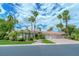 Beautiful home showcasing lush landscaping and a driveway leading to a three-car garage at 72 Innisbrook Ave, Las Vegas, NV 89113