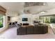 Spacious living area with a built-in bar, corner fireplace, and cozy seating, perfect for gatherings at 72 Innisbrook Ave, Las Vegas, NV 89113