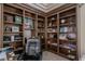 Office space featuring custom built-in wood shelving and carpeted flooring at 72 Innisbrook Ave, Las Vegas, NV 89113