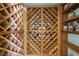 Custom wooden wine cellar showcasing intricate latticework design for organized bottle storage at 72 Innisbrook Ave, Las Vegas, NV 89113