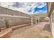 Backyard featuring a pergola-covered patio and block wall at 7413 Red Eagle St, Las Vegas, NV 89131